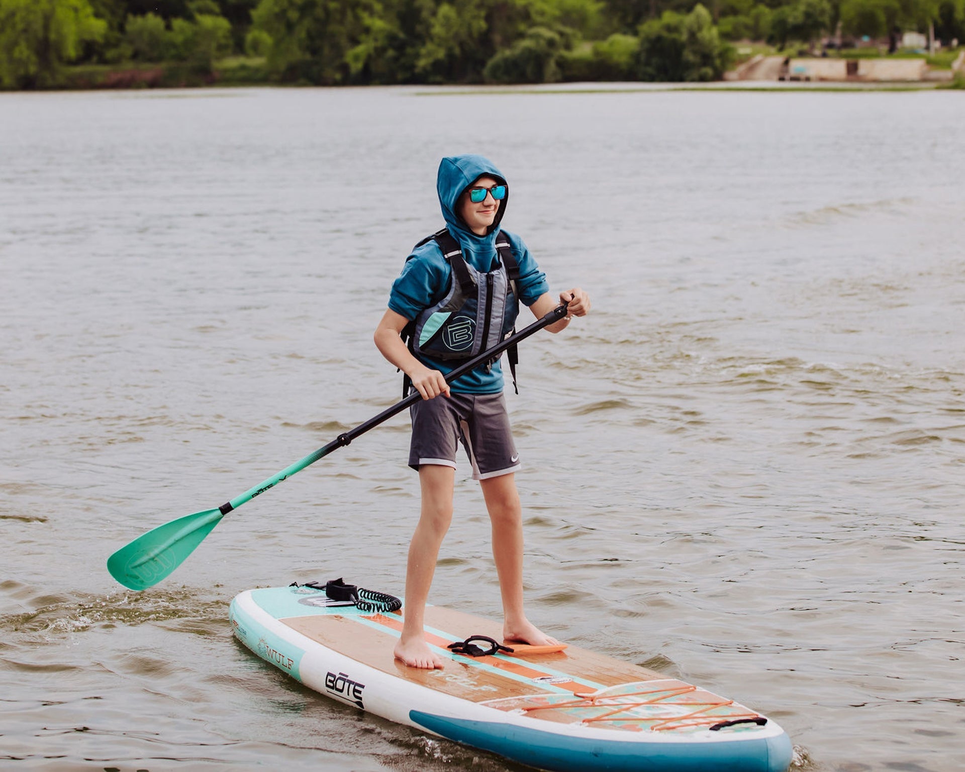 Person paddleboarding in southern Hill Country on a BOTE inflatable kayak 