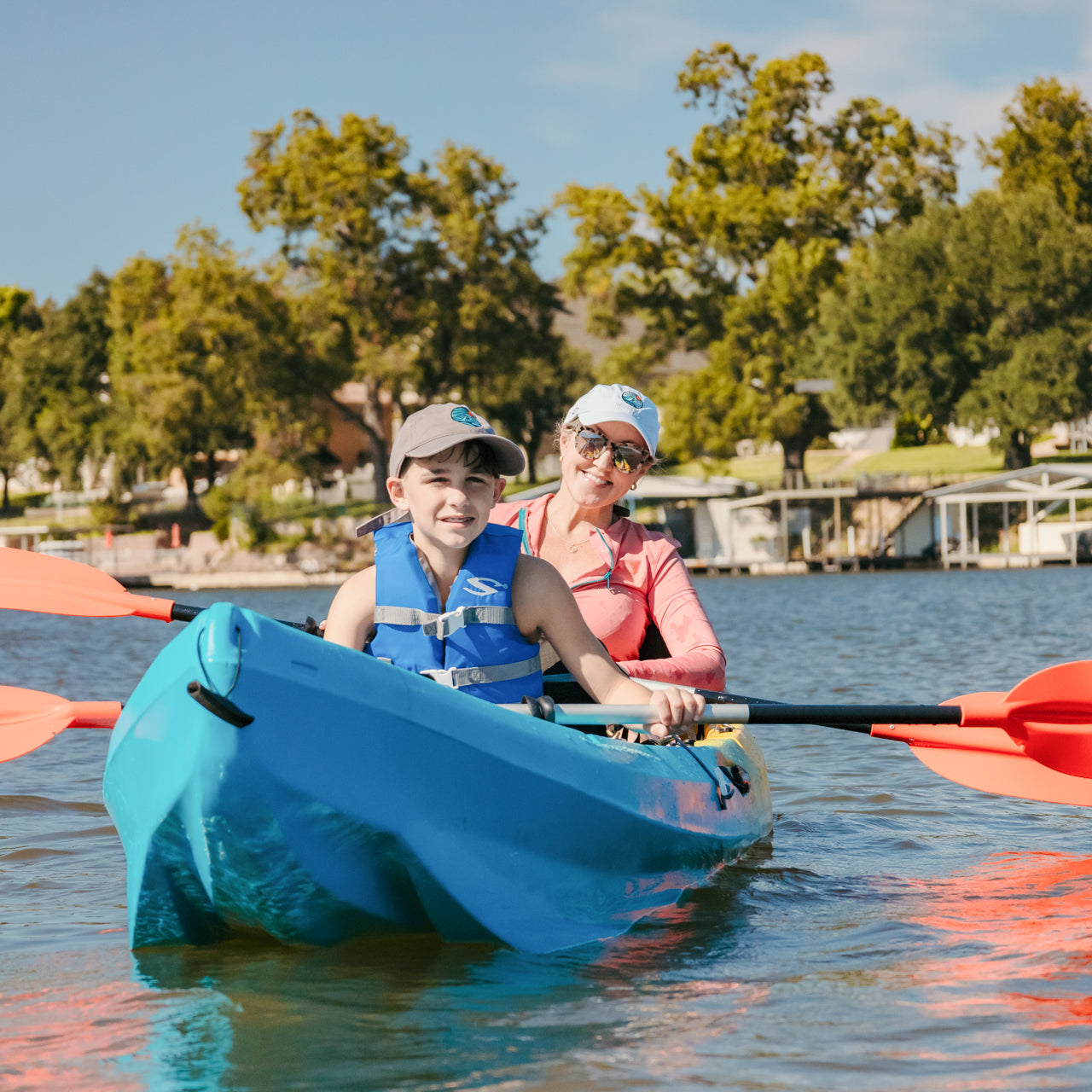 Two people enjoying the waters of central Texas in a tandem kayak